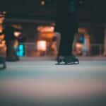 a person standing on top of a skateboard on a street