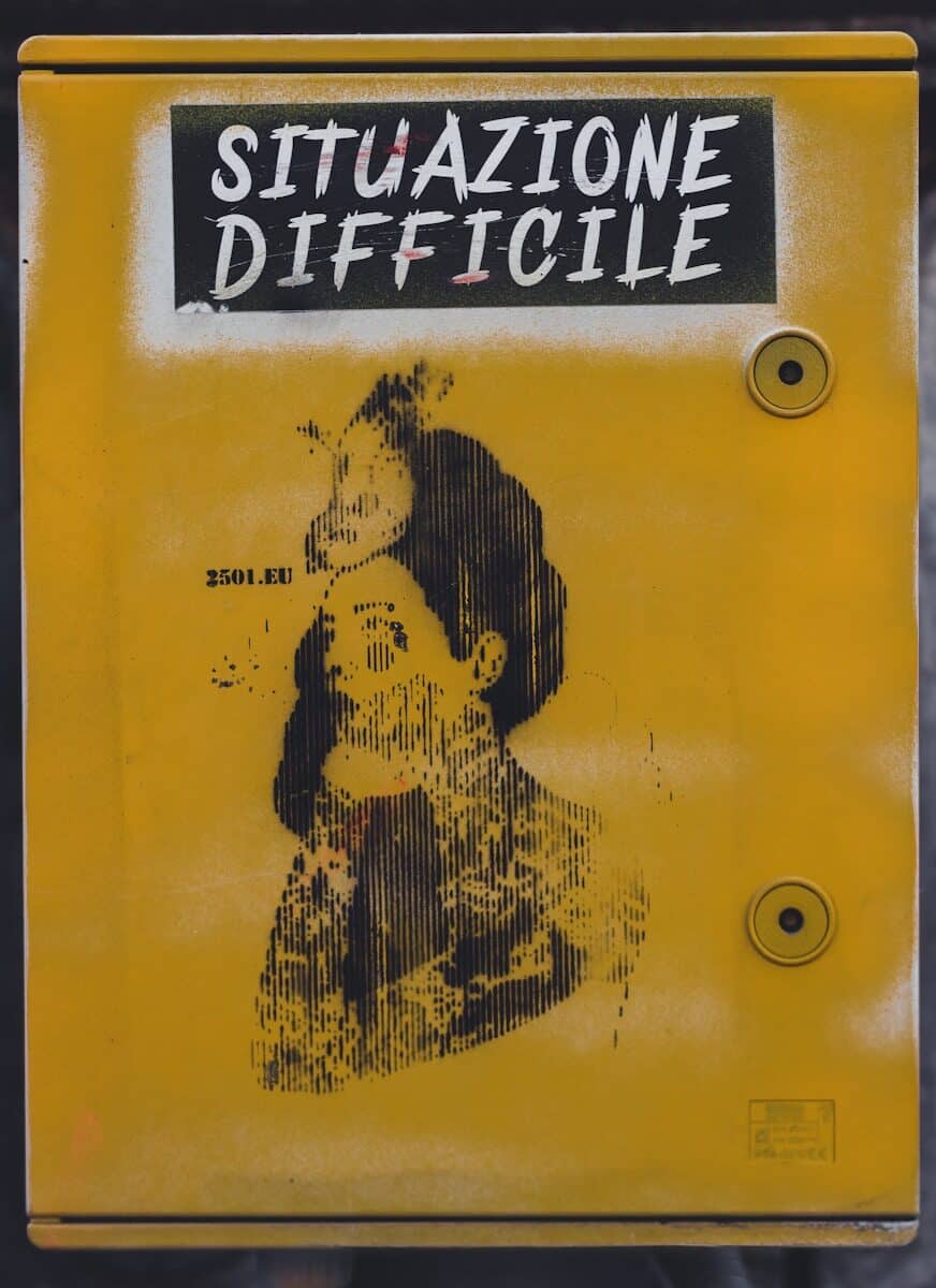 a yellow sign with a picture of a woman on it