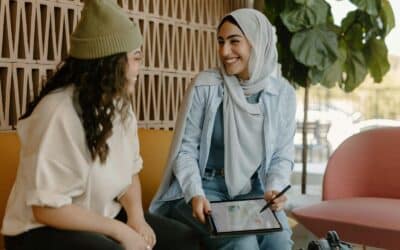a couple of women sitting on a couch