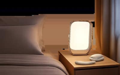 Une chambre premium illustrant une routine du soir apaisée avec une lumière douce et maîtrisée. L’ambiance évoque un meilleur cadrage du rythme veille-sommeil et un environnement propice au repos.